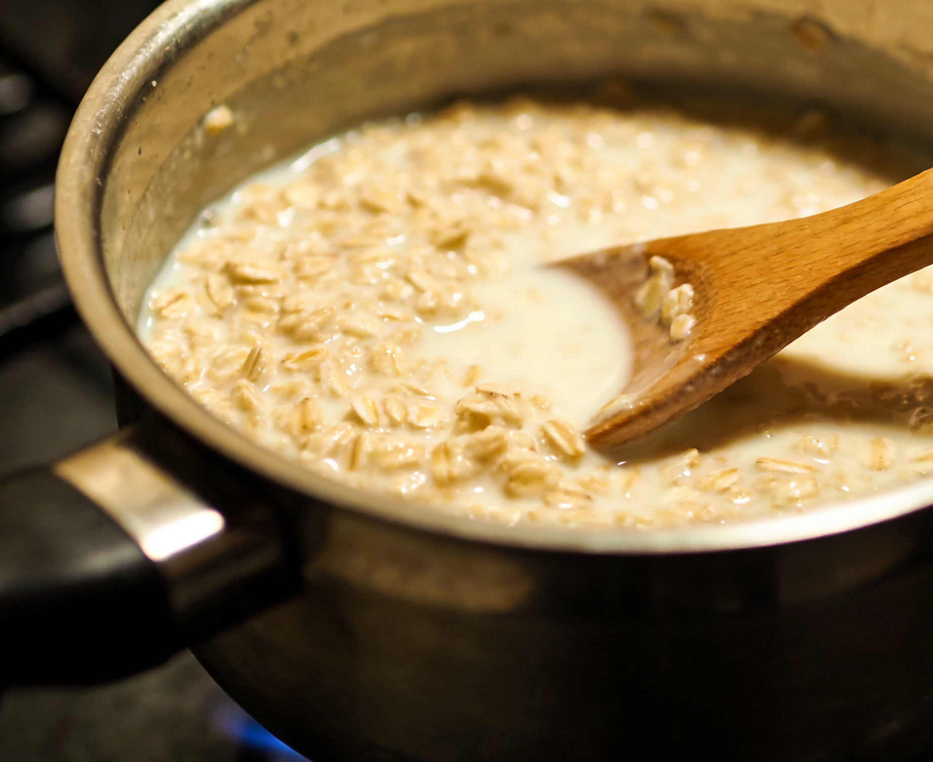 Stirring oats in a pot